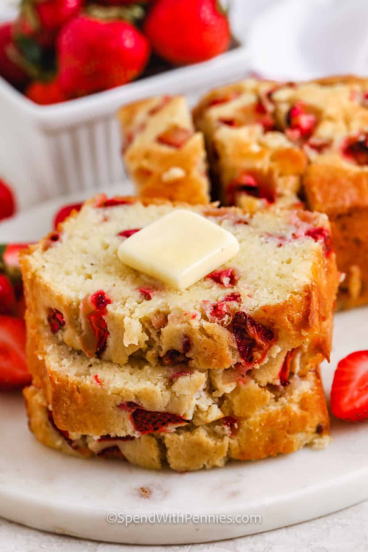 Strawberry Bread cut into slices with butter